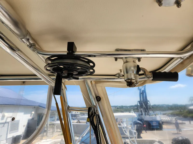 Slide: The Image of Fishing rod holder on 2005 Pursuit 3070 Offshore Center Console boat interior. - 48