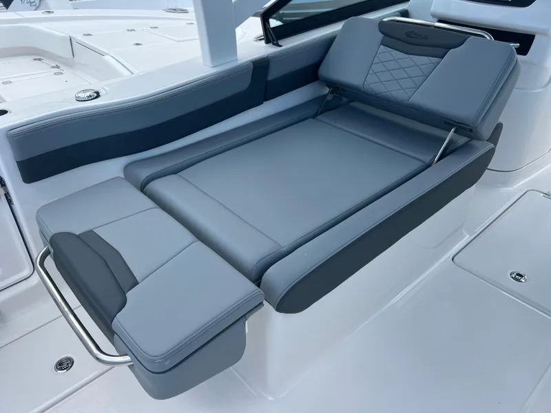 Slide: The Image of 2025 Robalo R257 Dual Console boat with sleek, modern seating design. - 14