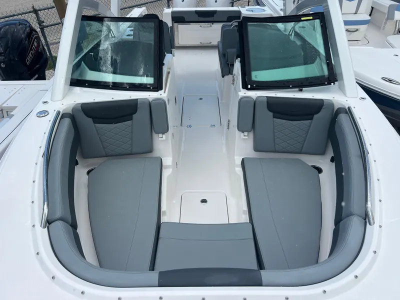 Slide: The Image of 2025 Robalo R257 Dual Console boat with spacious seating and modern design. - 20
