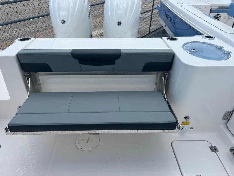 Slide: The Image of 2025 Robalo R257 Dual Console boat with foldable seating and sleek design. - 28