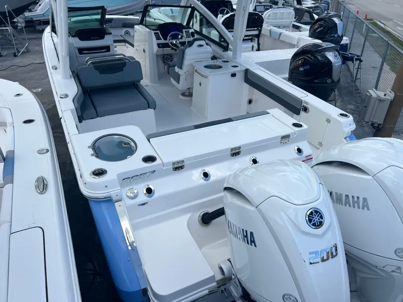 Slide: The Image of 2025 Robalo R257 Dual Console boat with Yamaha engines, featuring spacious seating and modern design. - 5