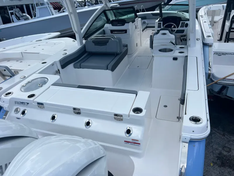 Slide: The Image of 2025 Robalo R257 Dual Console boat interior with seating and control panel. - 6