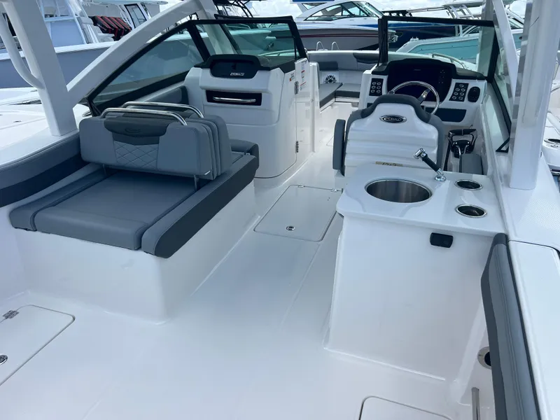 Slide: The Image of 2025 Robalo R257 Dual Console boat interior with seating and helm, featuring modern design. - 8