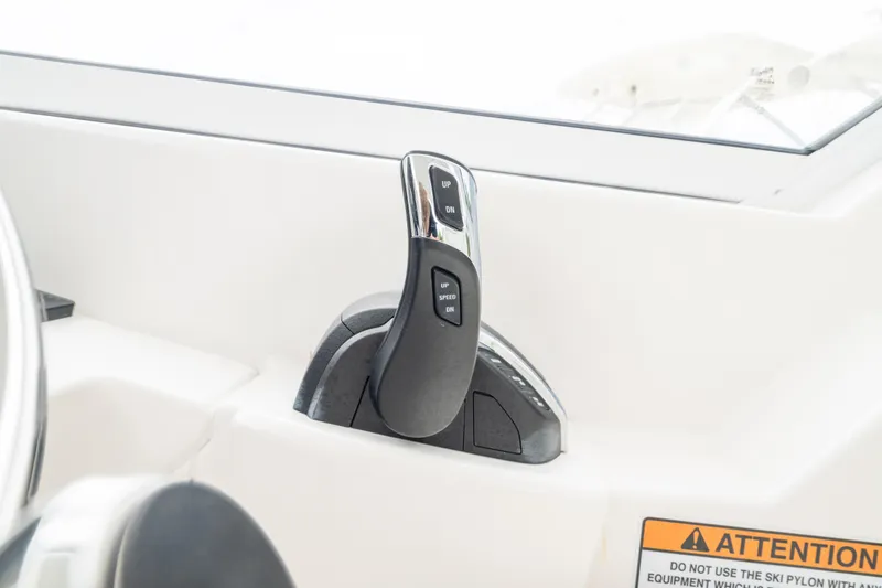 Slide: The Image of Throttle control of 2023 Edgewater 248 CX boat, featuring sleek design and ergonomic handle. - 29