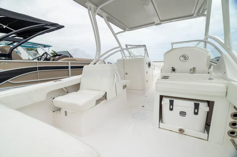 Slide: The Image of 2023 Edgewater 248 CX boat interior with seating and storage, showcasing modern design and functionality. - 3