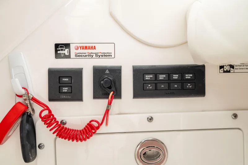 Slide: The Image of Control panel of 2023 Edgewater 248 CX boat featuring Yamaha security system. - 31