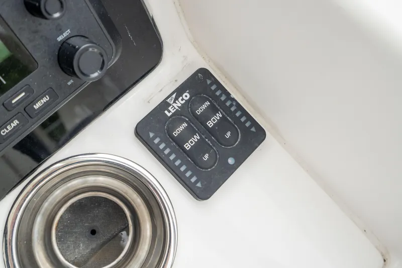 Slide: The Image of Control panel on 2023 Edgewater 248 CX boat with Lenco trim tab switches. - 33
