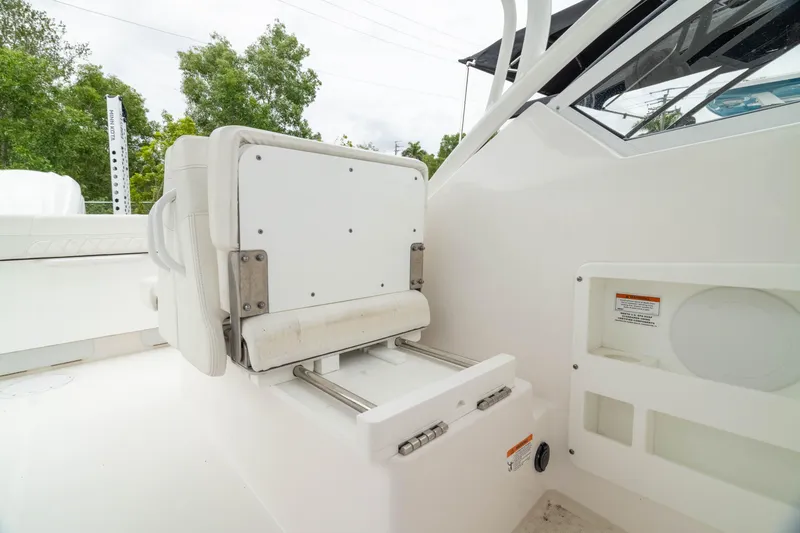 Slide: The Image of 2023 Edgewater 248 CX boat seat detail with white upholstery and adjustable features. - 37
