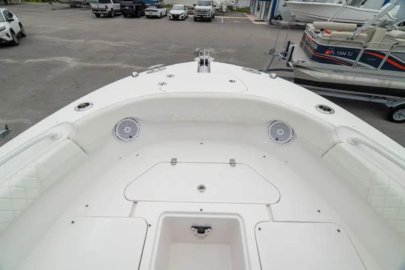 Slide: The Image of 2023 Edgewater 248 CX boat interior, featuring spacious seating and storage compartments. - 41