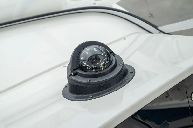 Slide: The Image of Compass on 2023 Edgewater 248 CX boat dashboard. - 45