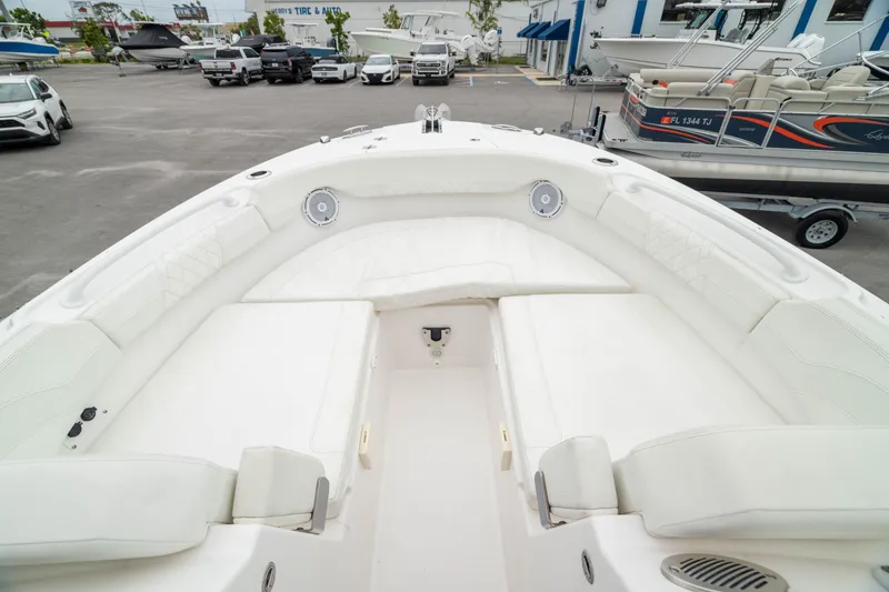 Slide: The Image of 2023 Edgewater 248 CX boat interior with spacious seating and modern design. - 7