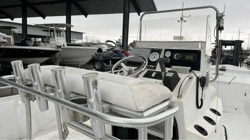 Slide: The Image of 2000 Blazer 186 boat on trailer, parked outdoors on a cloudy day. - 4