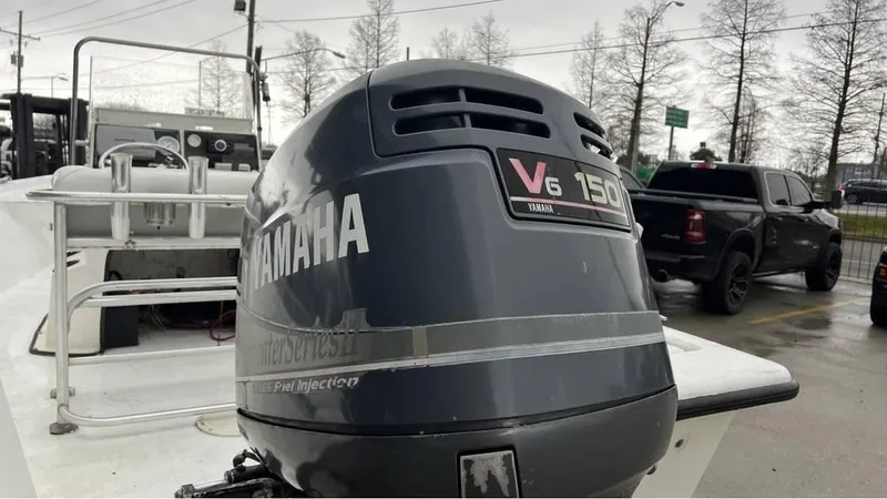 Slide: The Image of 2000 Blazer 186 boat on trailer with Yamaha outboard motor, parked outdoors. - 5
