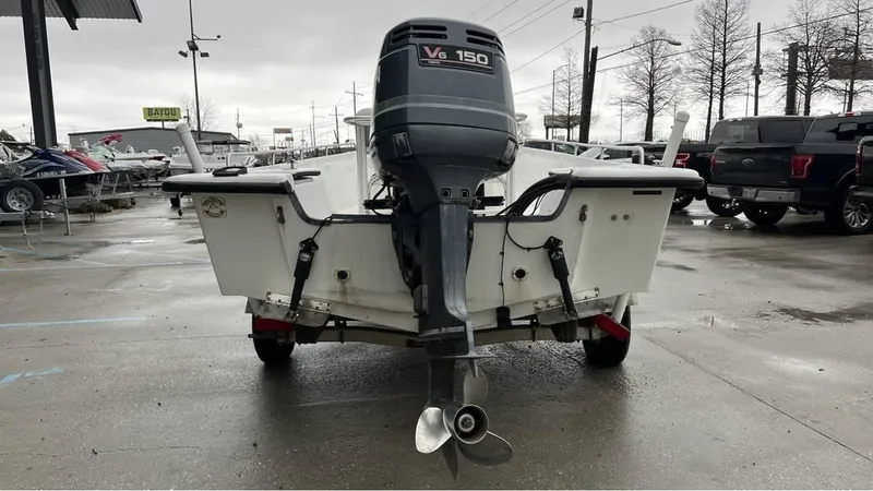 Slide: The Image of 2000 Blazer 186 boat with Yamaha V6 150 outboard motor in parking lot. - 8