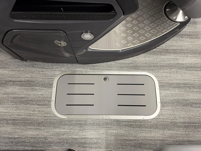 Slide: The Image of 2025 Bennington M Line boat interior with sleek flooring and storage compartment. - 13