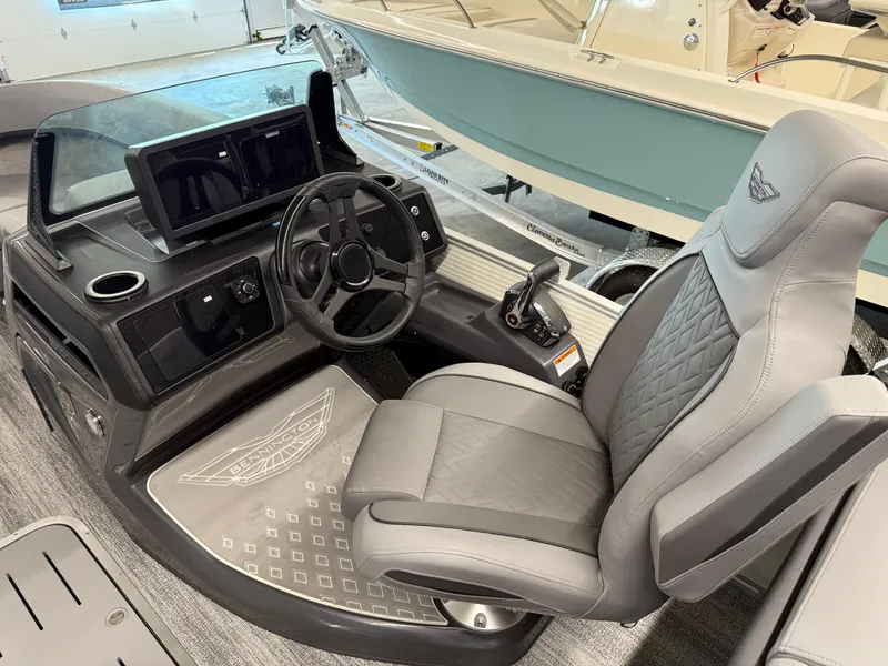 Slide: The Image of 2025 Bennington M Line boat cockpit with modern steering and luxurious seating. - 7