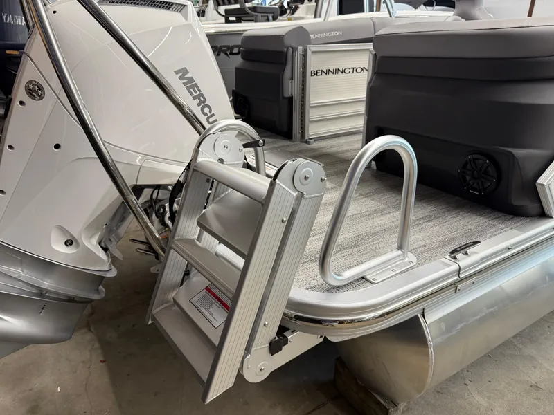 Slide: The Image of 2025 Bennington M Line pontoon boat with Mercury engine and boarding ladder. - 9