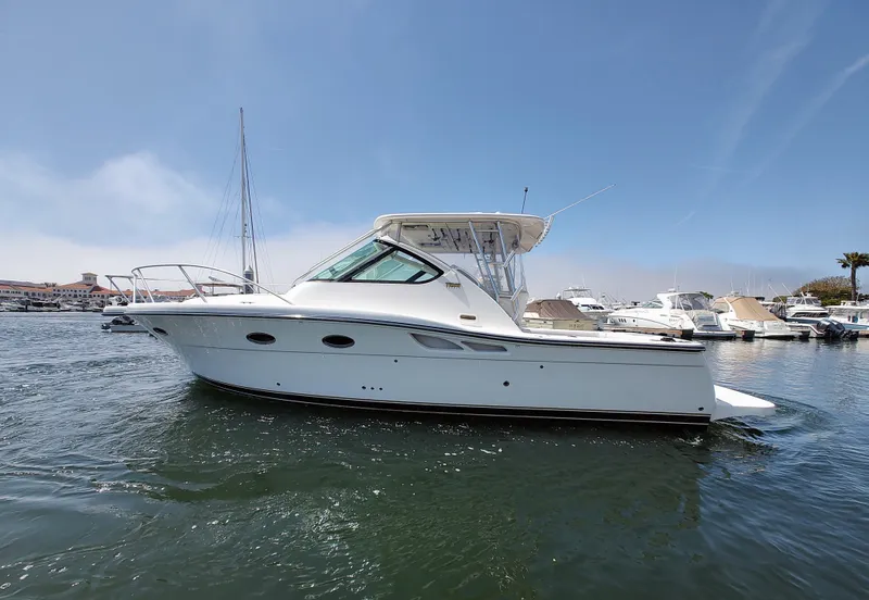The Image of 2008 Tiara Yachts 3200 Open, white, docked in marina under clear blue sky. - 1