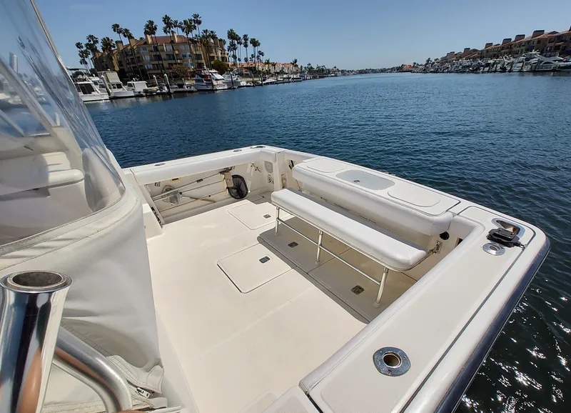 Slide: The Image of 2008 Tiara Yachts 3200 Open, spacious deck overlooking marina with clear blue water. - 10