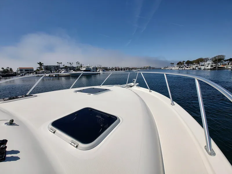 Slide: The Image of 2008 Tiara Yachts 3200 Open on calm water, marina view in background. - 14
