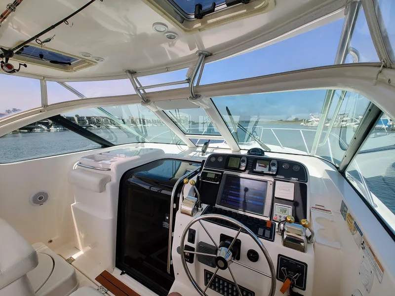 Slide: The Image of 2008 Tiara Yachts 3200 Open helm with modern controls and panoramic view. - 20