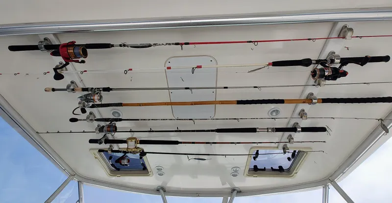 Slide: The Image of Fishing rods stored on a 2008 Tiara Yachts 3200 Open ceiling rack. - 23
