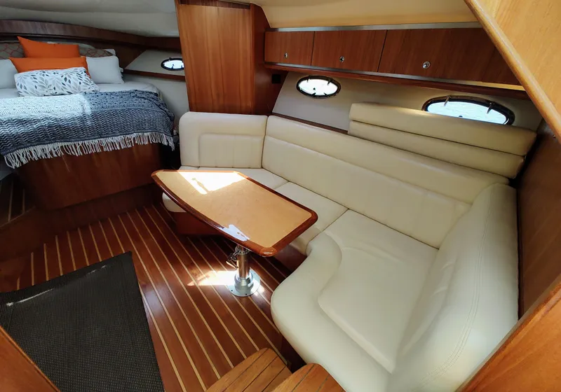Slide: The Image of 2008 Tiara Yachts 3200 Open interior with cozy seating and elegant wood finishes. - 27