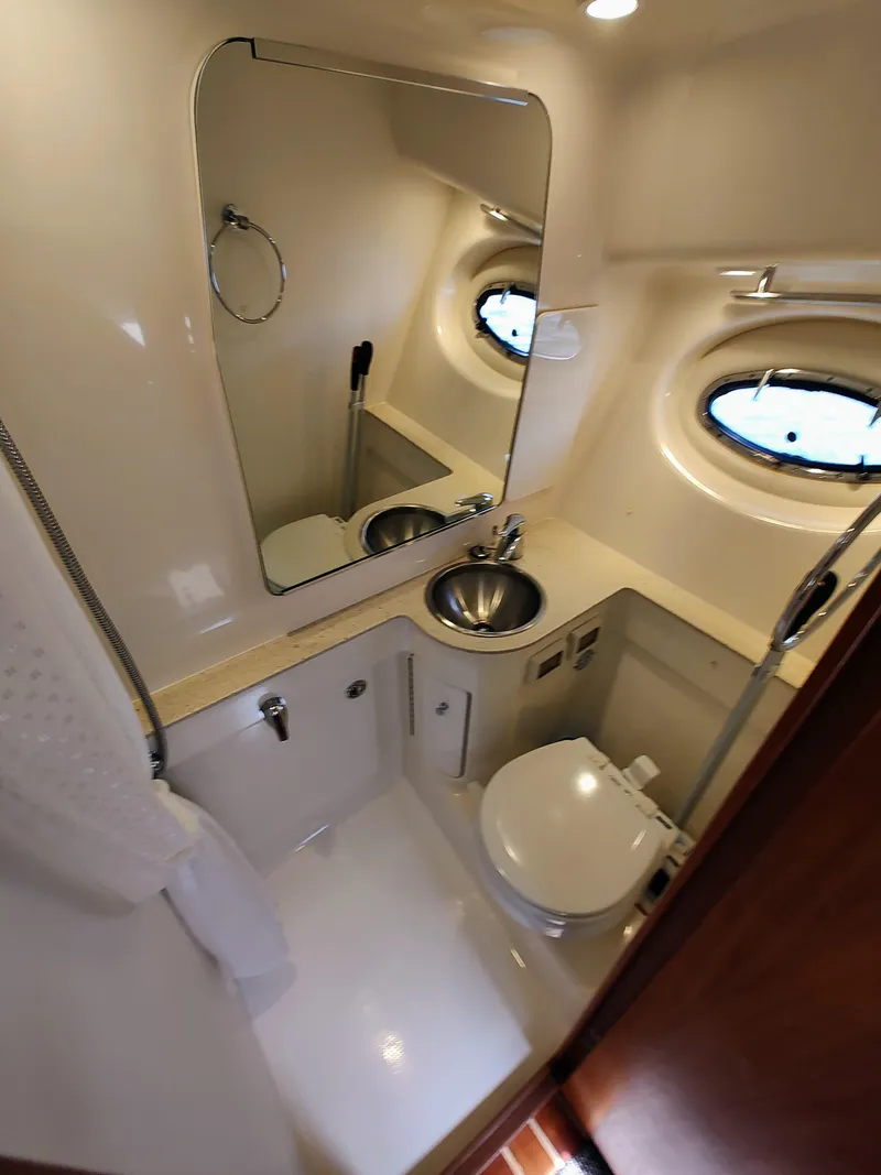 Slide: The Image of 2008 Tiara Yachts 3200 Open bathroom with sink, toilet, and mirror. - 32