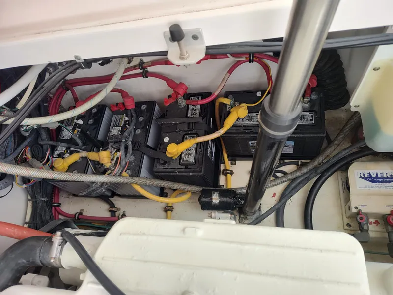 Slide: The Image of Engine compartment of 2008 Tiara Yachts 3200 Open, showing batteries and wiring. - 35