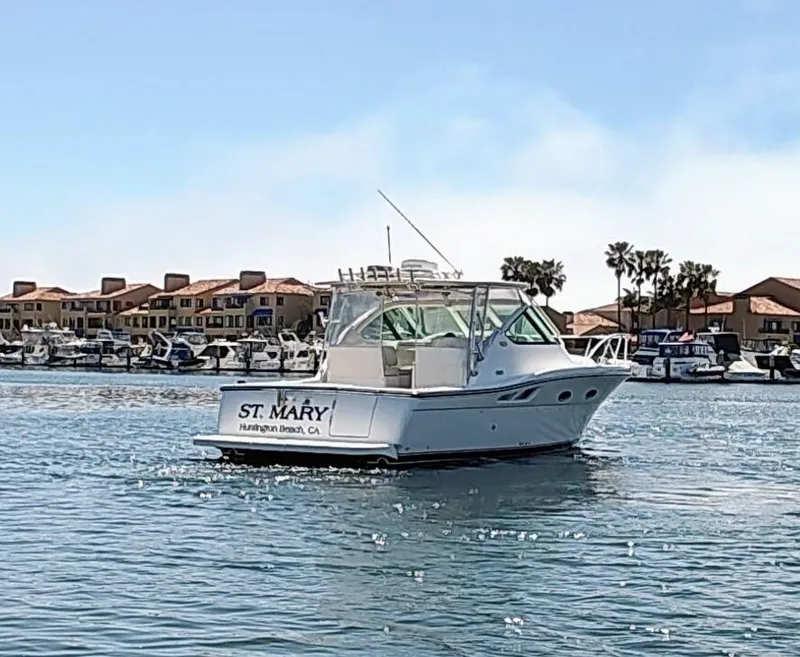 Slide: The Image of 2008 Tiara Yachts 3200 Open boat on water near marina, sunny day. - 5