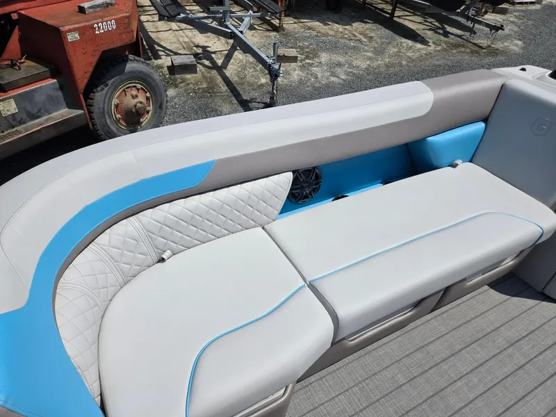 Slide: The Image of 2026 Godfrey SWEETWATER 2286 SB boat seating with blue and gray upholstery. - 11