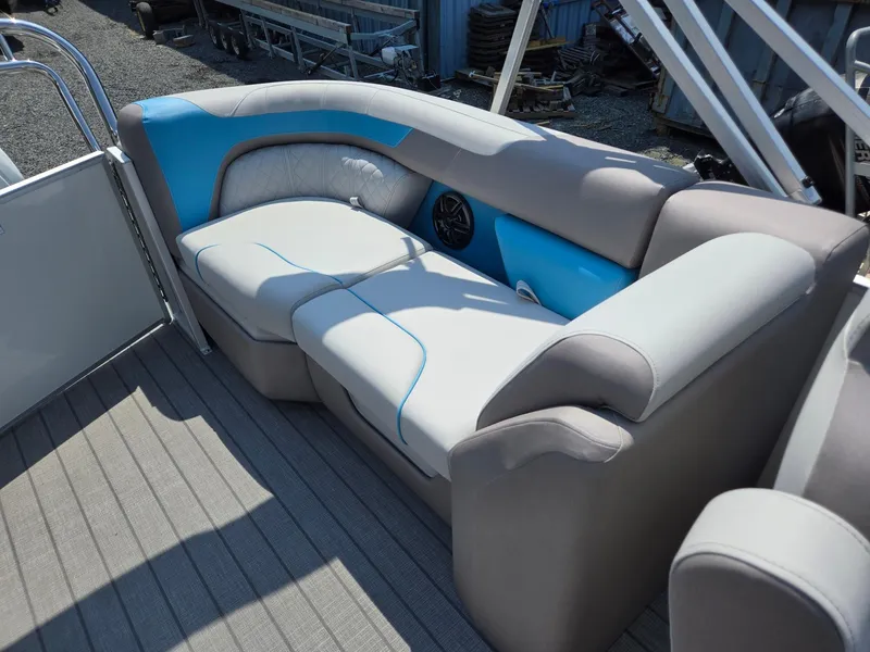 Slide: The Image of 2026 Godfrey SWEETWATER 2286 SB boat interior with gray and blue seating. - 24