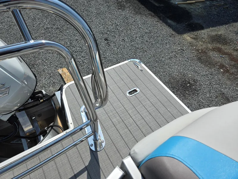 Slide: The Image of 2026 Godfrey SWEETWATER 2286 SB boat deck with stainless steel railing and seating. - 27