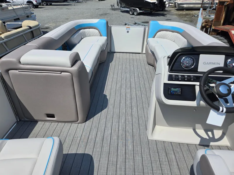 Slide: The Image of 2026 Godfrey SWEETWATER 2286 SB pontoon boat interior with seating and Garmin dashboard. - 31