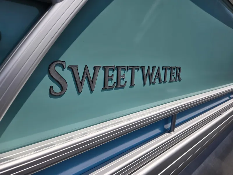 Slide: The Image of 2026 Godfrey SWEETWATER 2286 SB boat logo on teal background. - 37
