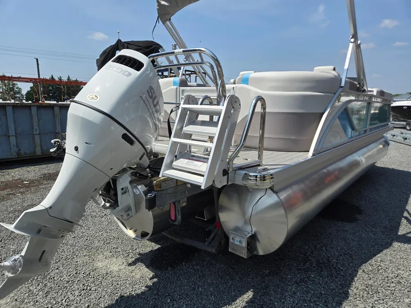 Slide: The Image of 2026 Godfrey SWEETWATER 2286 SB pontoon boat with outboard motor, ladder, and canopy. - 4