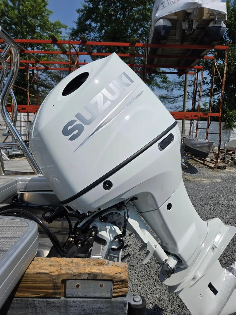 Slide: The Image of Suzuki outboard motor on 2026 Godfrey SWEETWATER 2286 SB pontoon boat, outdoor setting. - 41