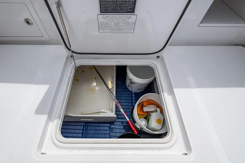 Slide: The Image of Storage compartment on a 2015 Bahama 41 boat with fishing gear and supplies. - 13