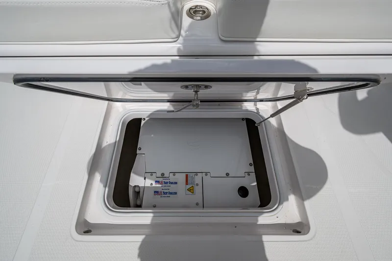 Slide: The Image of 2015 Bahama 41 boat hatch open, revealing storage compartment. - 15