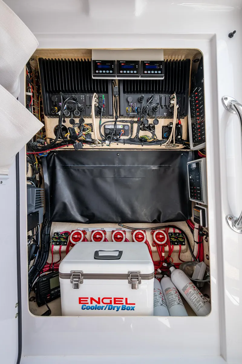 Slide: The Image of Electrical panel of a 2015 Bahama 41 boat with Engel cooler and wiring. - 19