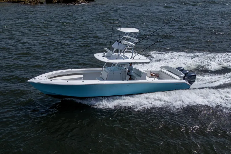 Slide: The Image of 2015 Bahama 41 boat cruising on open water with dual engines. - 33