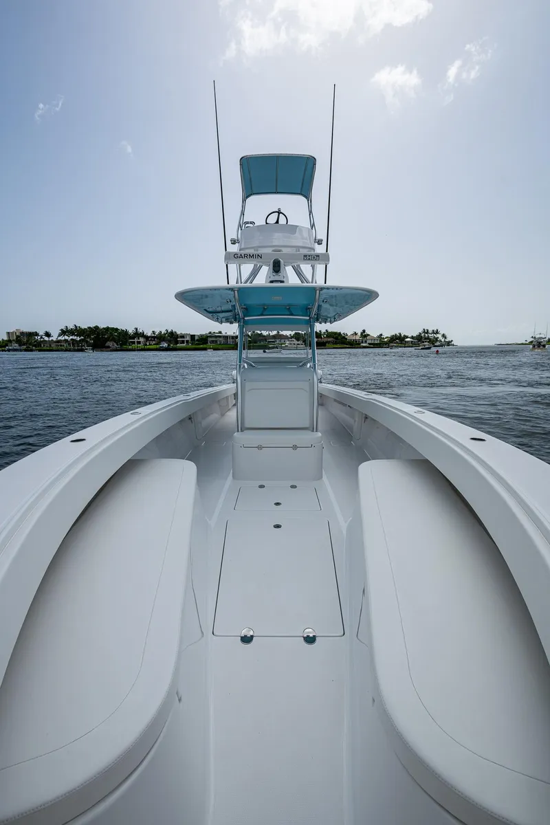 Slide: The Image of 2015 Bahama 41 boat on water, clear sky, view from bow. - 4