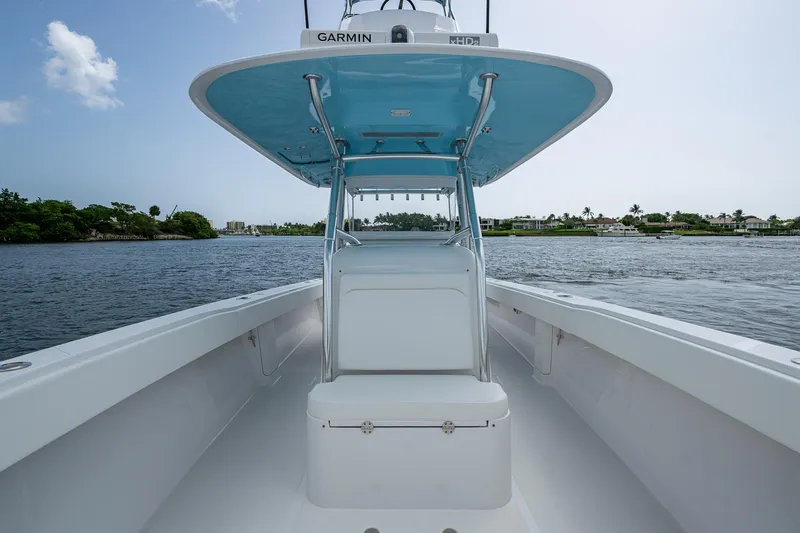 Slide: The Image of 2015 Bahama 41 boat on water, featuring a sleek design and spacious deck. - 5