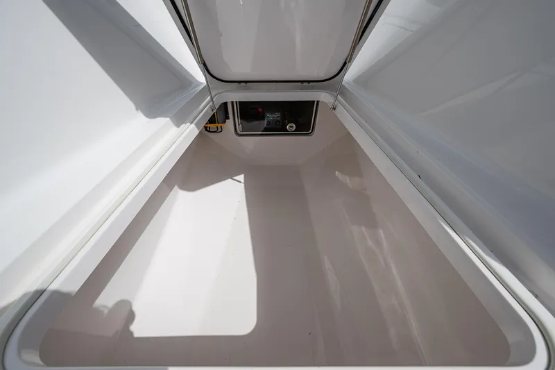 Slide: The Image of Storage compartment of a 2015 Bahama 41 boat, featuring a spacious interior. - 6