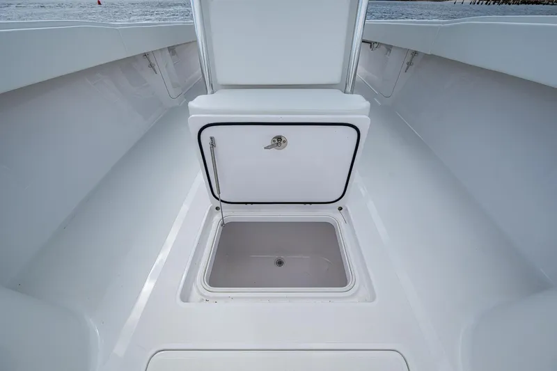 Slide: The Image of Open storage compartment on 2015 Bahama 41 boat deck, showcasing spacious interior. - 7