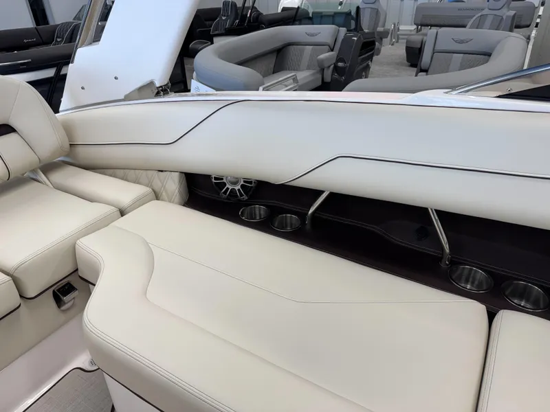 Slide: The Image of 2025 Regal LS4 boat interior with luxurious white seating and cup holders. - 12