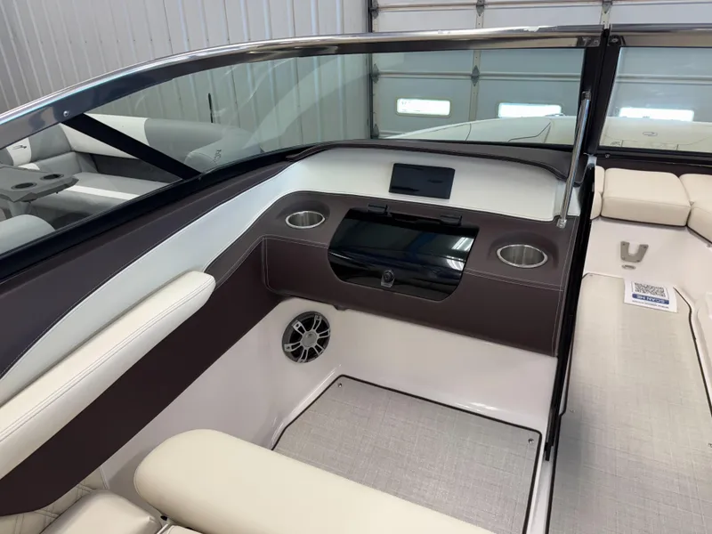 Slide: The Image of 2025 Regal LS4 boat interior with modern dashboard and seating. - 13