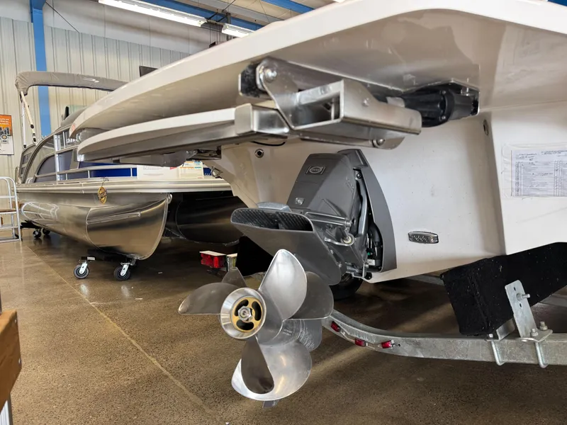 Slide: The Image of 2025 Regal LS4 boat with propeller in showroom, showcasing sleek design and advanced engineering. - 8