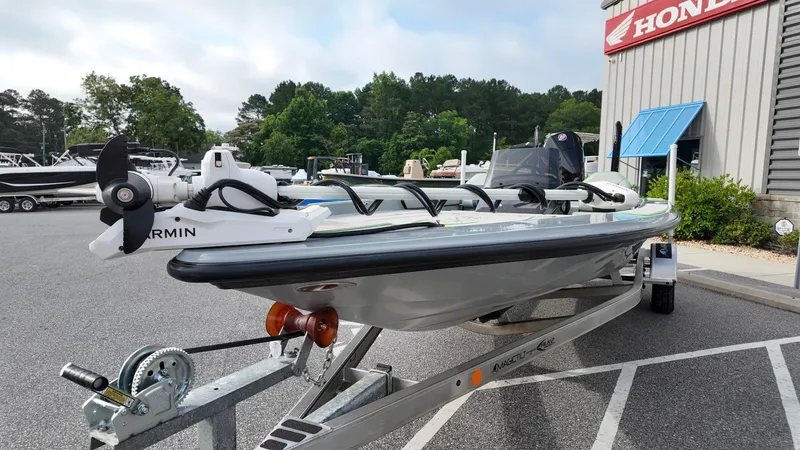 Slide: The Image of 2025 ALK2 Powerboats 21 BHX on trailer, featuring Garmin equipment, parked outside dealership. - 10