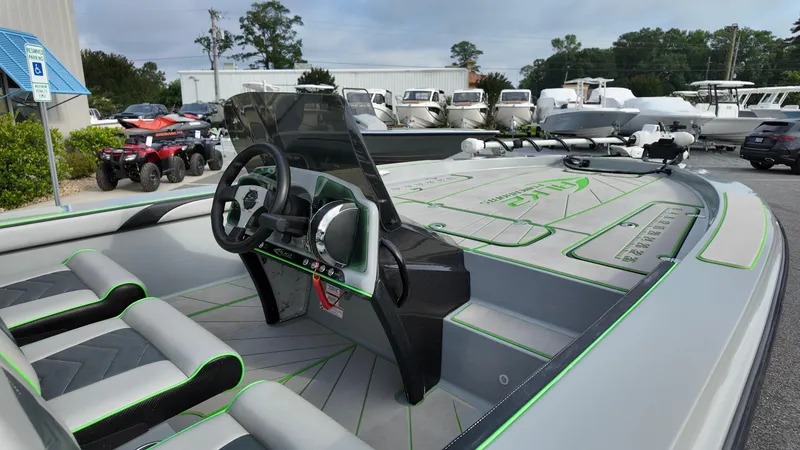 Slide: The Image of 2025 ALK2 Powerboats 21 BHX with sleek design, modern dashboard, and spacious seating. - 12